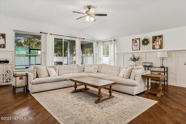 800 Marjories Way, Saint Augustine, FL 32092 - living area featuring a ceiling fan, vaulted ceiling, dark wood-style floors, a wainscoted wall, and a decorative wall
