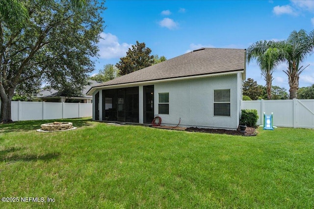 800 Marjories Way, Saint Augustine, FL 32092 - back of property featuring a sunroom, a fenced backyard, a fire pit, and a shingled roof