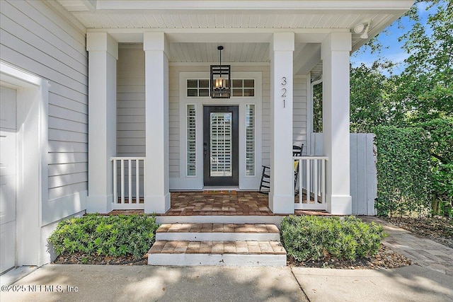 321 5th St, Atlantic Beach, FL 32233 - property entrance featuring covered porch