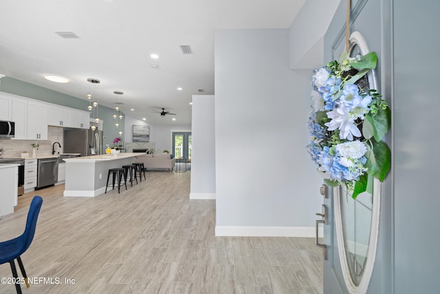 3064 Hickory Glen Dr, Jacksonville, FL 32065 - entrance foyer with light wood-type flooring, ceiling fan, recessed lighting, and baseboards
