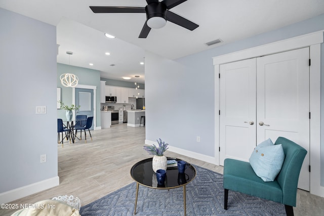 3064 Hickory Glen Dr, Jacksonville, FL 32065 - sitting room featuring a ceiling fan, light wood-type flooring, baseboards, and recessed lighting