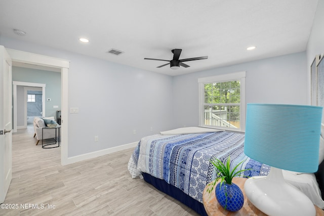 3064 Hickory Glen Dr, Jacksonville, FL 32065 - bedroom with multiple windows, wood finished floors, baseboards, recessed lighting, and a ceiling fan