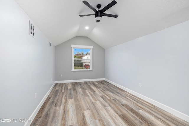 3064 Hickory Glen Dr, Jacksonville, FL 32065 - additional living space with a ceiling fan, lofted ceiling, wood finished floors, and baseboards