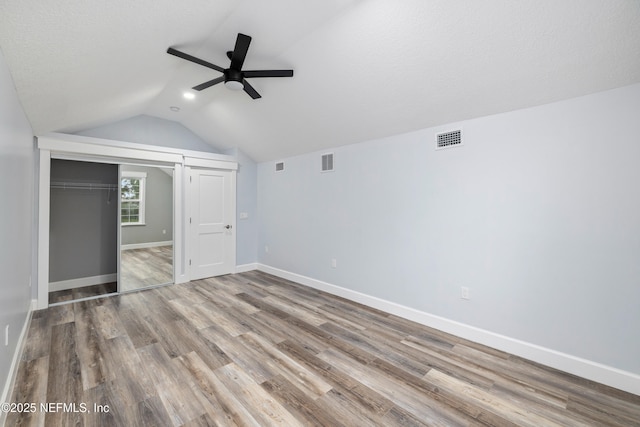 3064 Hickory Glen Dr, Jacksonville, FL 32065 - unfurnished bedroom with vaulted ceiling, wood finished floors, a closet, baseboards, and a ceiling fan