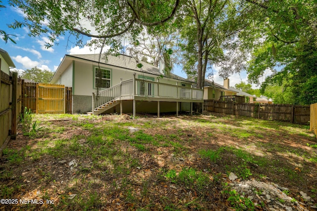 3064 Hickory Glen Dr, Jacksonville, FL 32065 - rear view of house featuring stairs, a deck, and a fenced backyard