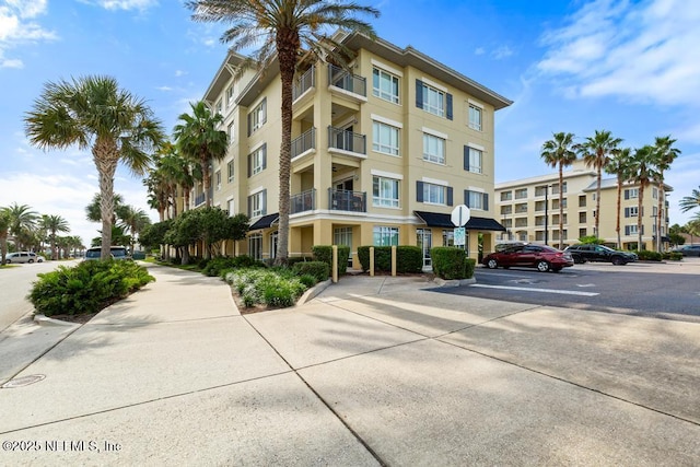 525 3rd St S Unit 513, Jacksonville Beach, FL 32250 - view of apartment building / complex featuring uncovered parking