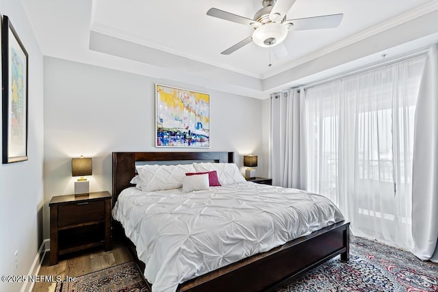 525 3rd St S Unit 513, Jacksonville Beach, FL 32250 - bedroom with wood finished floors, ornamental molding, a ceiling fan, and a raised ceiling