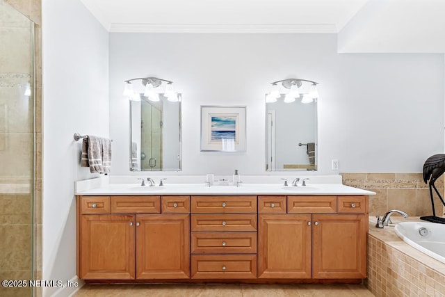 525 3rd St S Unit 513, Jacksonville Beach, FL 32250 - bathroom with tiled shower, double vanity, a garden tub, and ornamental molding