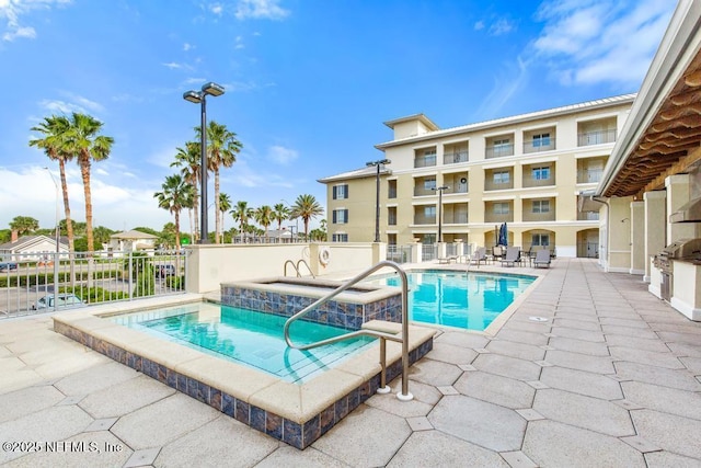 525 3rd St S Unit 513, Jacksonville Beach, FL 32250 - community pool featuring a hot tub and a patio