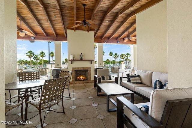 525 3rd St S Unit 513, Jacksonville Beach, FL 32250 - view of patio / terrace featuring a ceiling fan and an outdoor living space with a fireplace