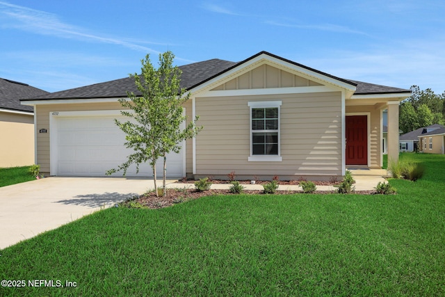 4628 Argand Dr, Jacksonville, FL 32218 - ranch-style house featuring concrete driveway, a garage, roof with shingles, and a front lawn