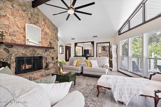 5265 State Rd 13 N, Saint Augustine, FL 32092 - living area featuring a ceiling fan, high vaulted ceiling, wood finished floors, beamed ceiling, and a fireplace