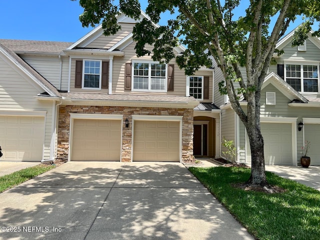 11110 Castlemain Cir S, Jacksonville, FL 32256 - multi unit property with an attached garage, driveway, stone siding, and a shingled roof