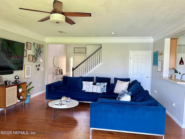 11110 Castlemain Cir S, Jacksonville, FL 32256 - living area with stairway, hardwood / wood-style flooring, a textured ceiling, crown molding, and a ceiling fan