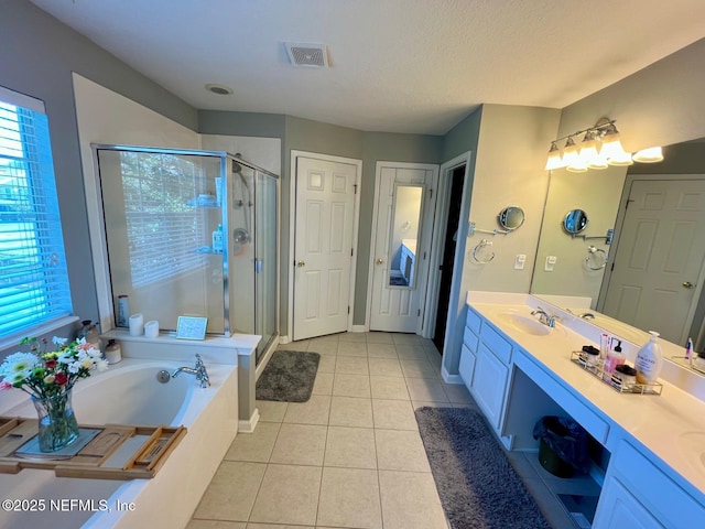 11110 Castlemain Cir S, Jacksonville, FL 32256 - bathroom featuring tile patterned flooring, double vanity, a bath, and a shower stall