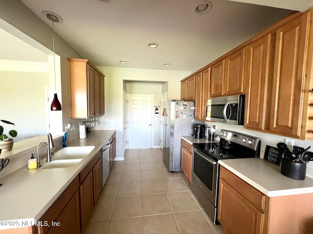 11110 Castlemain Cir S, Jacksonville, FL 32256 - kitchen with appliances with stainless steel finishes, light tile patterned flooring, brown cabinetry, light countertops, and recessed lighting