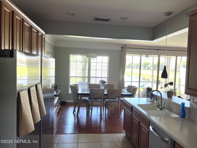 11110 Castlemain Cir S, Jacksonville, FL 32256 - dining space featuring ornamental molding, light tile patterned floors, and a textured ceiling