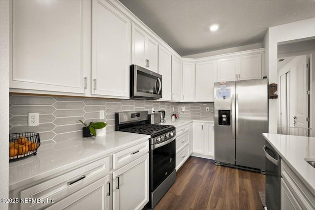 54 Torres Trce, Saint Augustine, FL 32095 - kitchen with stainless steel appliances, white cabinetry, light countertops, tasteful backsplash, and recessed lighting