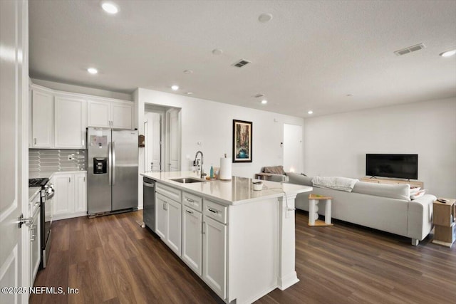 54 Torres Trce, Saint Augustine, FL 32095 - kitchen with appliances with stainless steel finishes, dark wood-type flooring, open floor plan, and recessed lighting