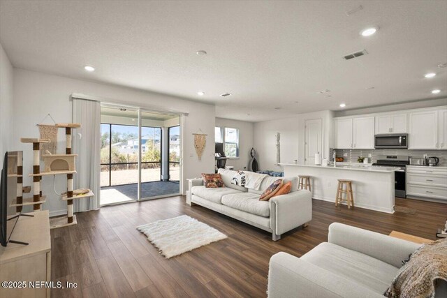 54 Torres Trce, Saint Augustine, FL 32095 - living area with recessed lighting and dark wood-style flooring