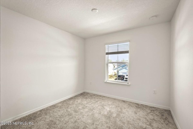 54 Torres Trce, Saint Augustine, FL 32095 - carpeted empty room with baseboards and a textured ceiling