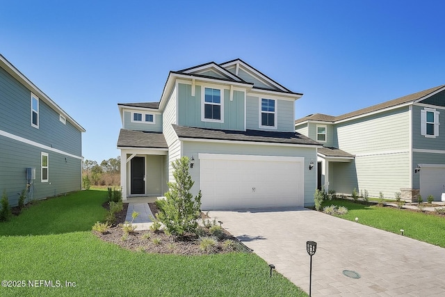 54 Torres Trce, Saint Augustine, FL 32095 - view of front of home featuring an attached garage, decorative driveway, and a front yard