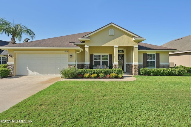 1804 Eagle Crest Dr, Fleming Island, FL 32003 - view of front of home with stone siding, stucco siding, a garage, driveway, and a front yard