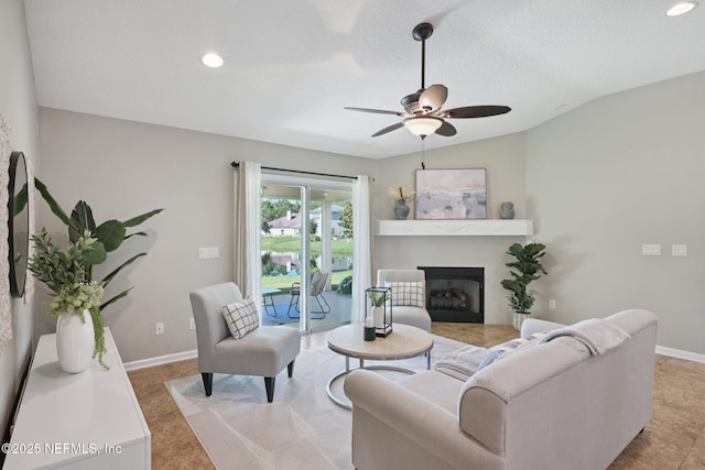 1804 Eagle Crest Dr, Fleming Island, FL 32003 - living room featuring ceiling fan, a glass covered fireplace, vaulted ceiling, and recessed lighting