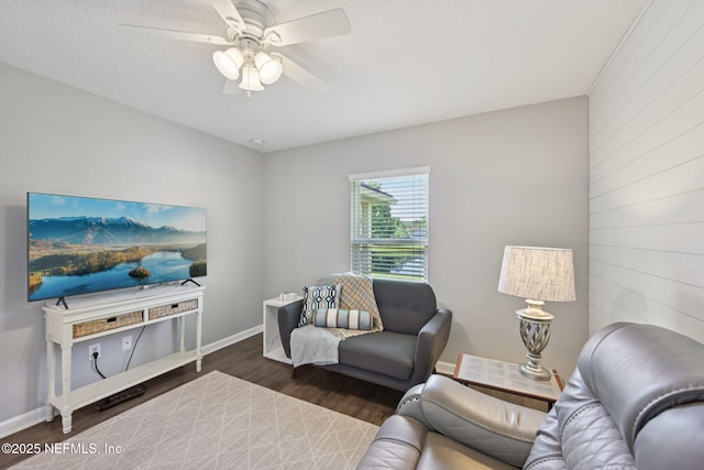 1804 Eagle Crest Dr, Fleming Island, FL 32003 - living room featuring wood finished floors, a ceiling fan, and wooden walls