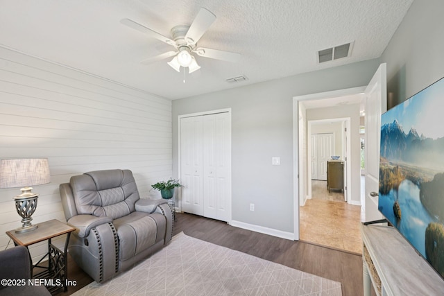 1804 Eagle Crest Dr, Fleming Island, FL 32003 - sitting room featuring wood finished floors, ceiling fan, and a textured ceiling