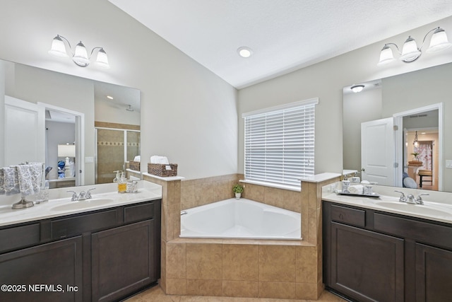 1804 Eagle Crest Dr, Fleming Island, FL 32003 - bathroom featuring a shower stall, two vanities, a bath, vaulted ceiling, and tile patterned floors