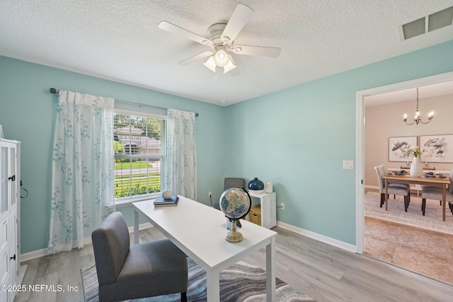 1804 Eagle Crest Dr, Fleming Island, FL 32003 - office space with light wood finished floors, a ceiling fan, a chandelier, and a textured ceiling
