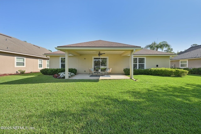 1804 Eagle Crest Dr, Fleming Island, FL 32003 - rear view of house featuring ceiling fan, a patio, a lawn, and stucco siding