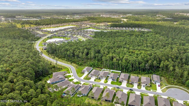 1382 Parkland Trl, Saint Augustine, FL 32095 - aerial view of property and surrounding area with a forest, nearby suburban area, and a large body of water