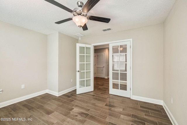 1382 Parkland Trl, Saint Augustine, FL 32095 - unfurnished room with french doors, wood finish floors, baseboards, and a ceiling fan