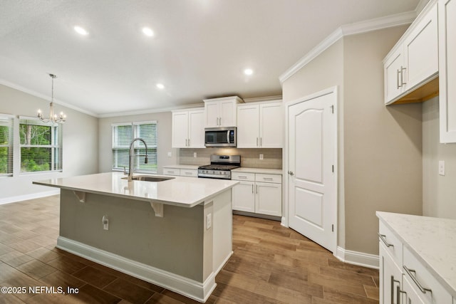 1382 Parkland Trl, Saint Augustine, FL 32095 - kitchen with stainless steel appliances, a sink, crown molding, decorative backsplash, and baseboards