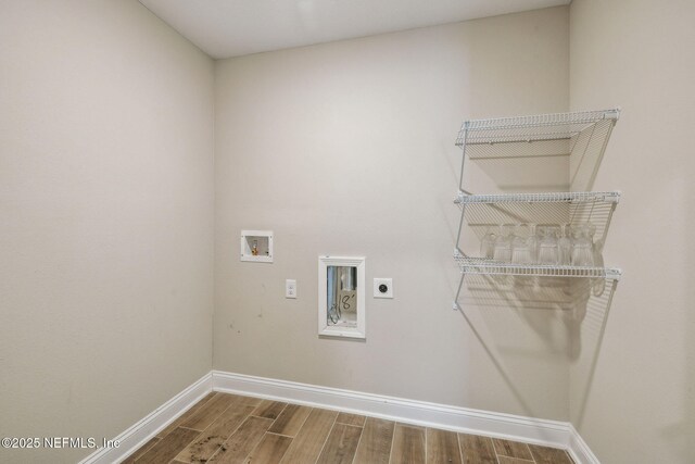 1382 Parkland Trl, Saint Augustine, FL 32095 - laundry area featuring electric dryer hookup, wood finished floors, baseboards, and hookup for a washing machine