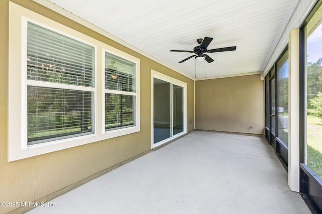 1382 Parkland Trl, Saint Augustine, FL 32095 - unfurnished sunroom with ceiling fan and concrete floors