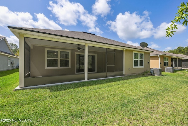 1382 Parkland Trl, Saint Augustine, FL 32095 - back of house with a sunroom, a ceiling fan, cooling unit, and a lawn