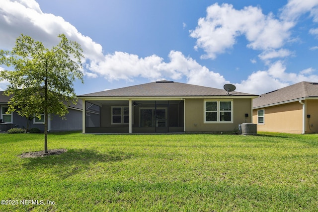 1382 Parkland Trl, Saint Augustine, FL 32095 - rear view of house with a sunroom, a yard, central AC, and stucco siding