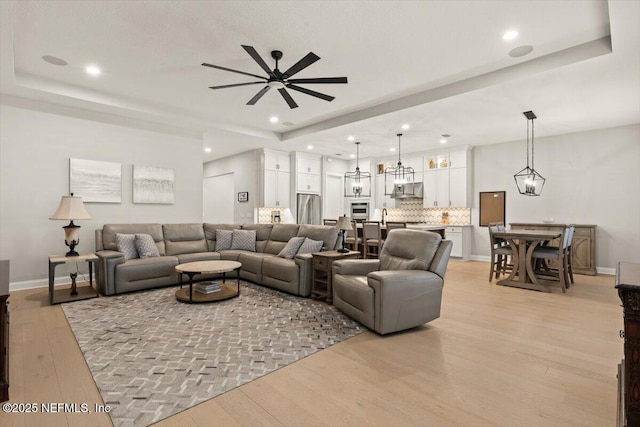 87 Tradesman Ln, Saint Johns, FL 32259 - living area with light wood finished floors, ceiling fan, recessed lighting, and a raised ceiling