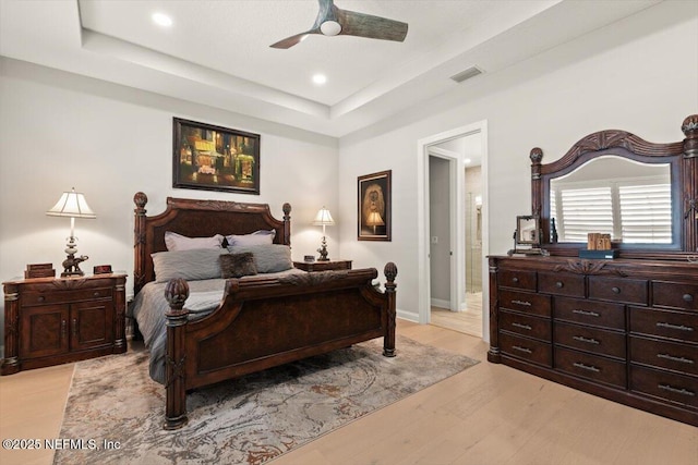 87 Tradesman Ln, Saint Johns, FL 32259 - bedroom with a tray ceiling, light wood-style floors, recessed lighting, and ceiling fan