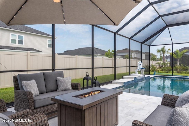 87 Tradesman Ln, Saint Johns, FL 32259 - fenced backyard featuring a patio, glass enclosure, and an outdoor living space with a fire pit