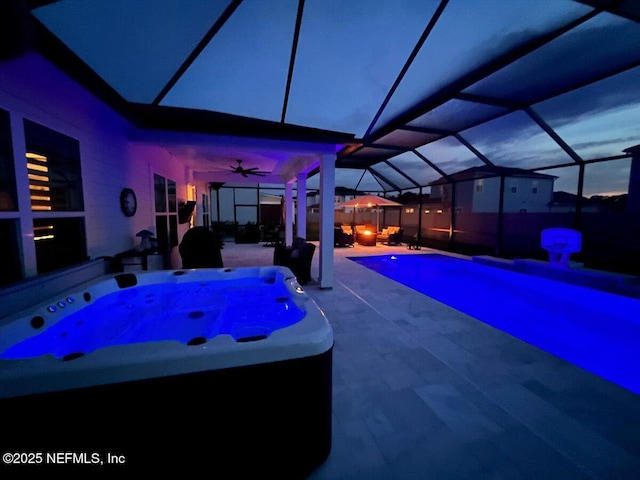 87 Tradesman Ln, Saint Johns, FL 32259 - pool at twilight with a hot tub, a patio, ceiling fan, an outdoor pool, and a lanai
