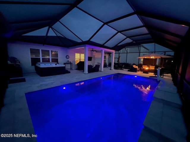 87 Tradesman Ln, Saint Johns, FL 32259 - pool at night with outdoor lounge area, a hot tub, a patio, and a ceiling fan
