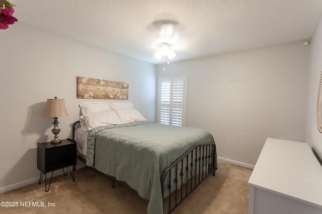 7677 Crosstree Ln, Jacksonville, FL 32256 - bedroom with light carpet, a textured ceiling, and baseboards