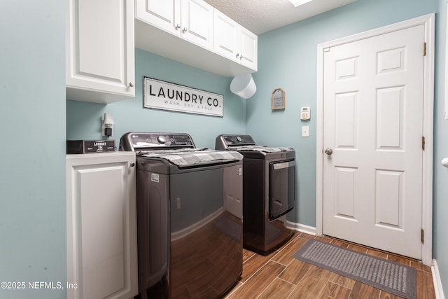 7677 Crosstree Ln, Jacksonville, FL 32256 - laundry area with separate washer and dryer, cabinet space, wood finish floors, and baseboards