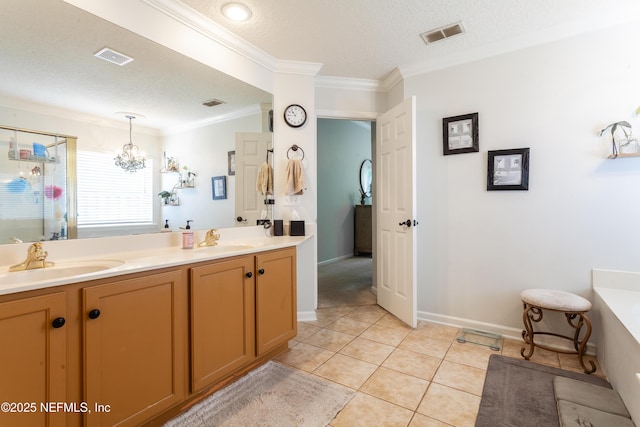 7677 Crosstree Ln, Jacksonville, FL 32256 - full bath with crown molding, double vanity, a textured ceiling, a tub to relax in, and a chandelier