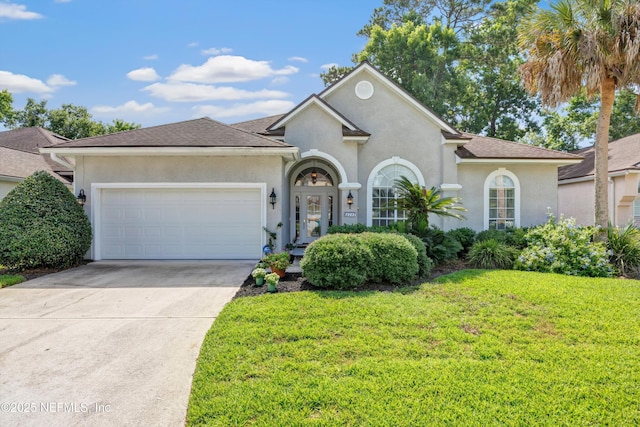 6542 Burnham Cir, Ponte Vedra Beach, FL 32082 - view of front of property featuring a garage, stucco siding, a front yard, driveway, and a shingled roof