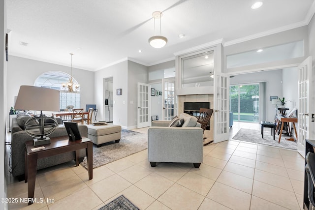 6542 Burnham Cir, Ponte Vedra Beach, FL 32082 - living area featuring light tile patterned floors, ornamental molding, a chandelier, french doors, and recessed lighting